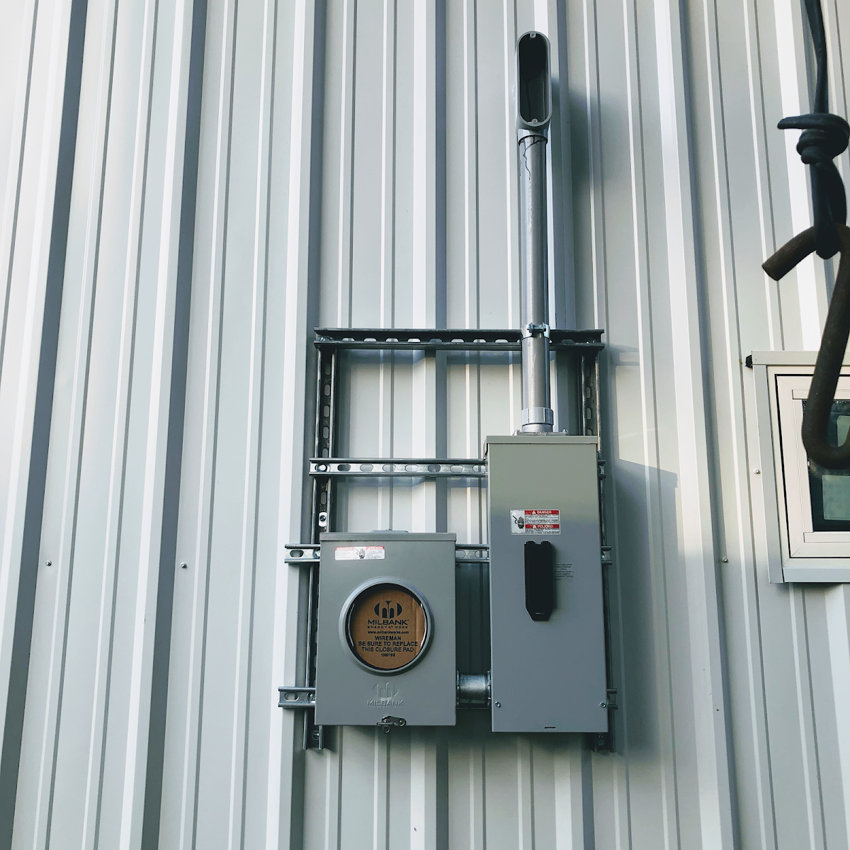 Exterior meter and panel on a metal building